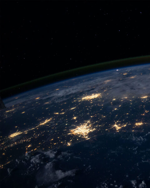 Image of earth at night from space showing the lights from cities