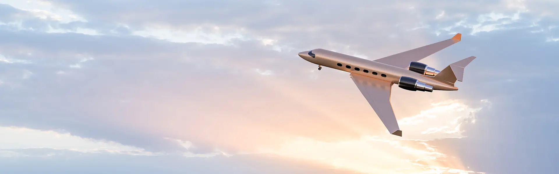 A private jet with sunlit clouds in the background.