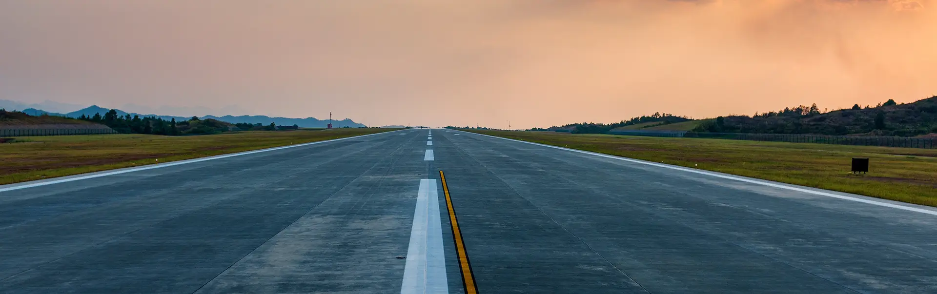 Runway with pink skies